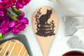 Black Cat Sittong On Books Wooden Cooking Spoon Kitchen